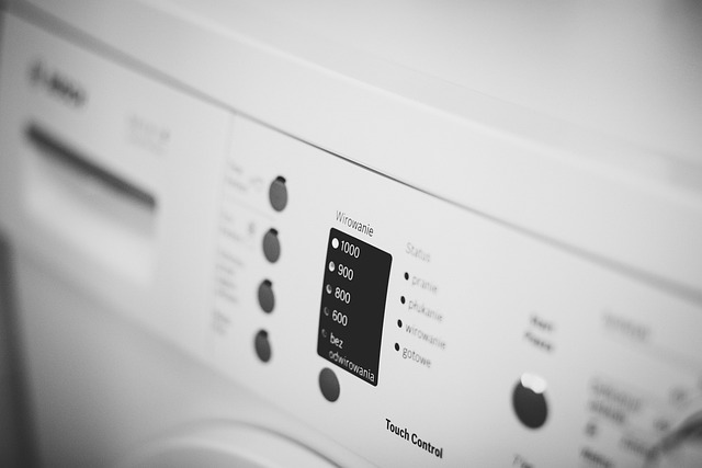 home appliances showroom area with refrigerators washing machines and product tags